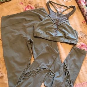 Sage green Alo yoga bra and pants.